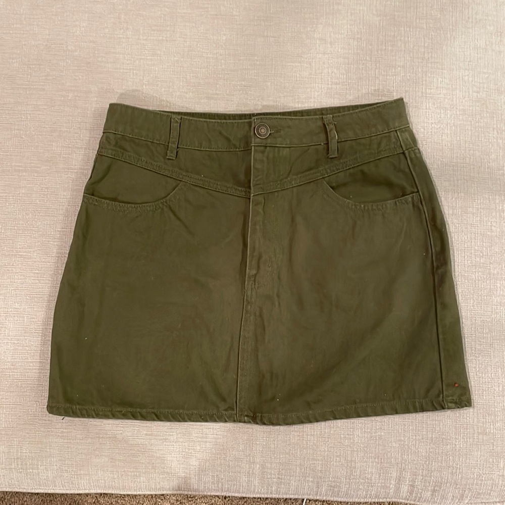 Olive green, classic denim, mini skirt, two pockets, zip, and button front.